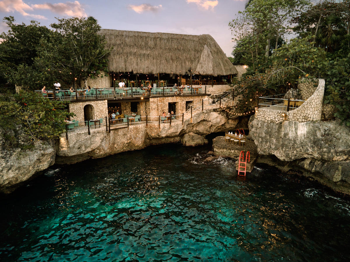 Rockhouse Restaurant Negril cliffside dining terrace overlooking the Caribbean Sea at sunset