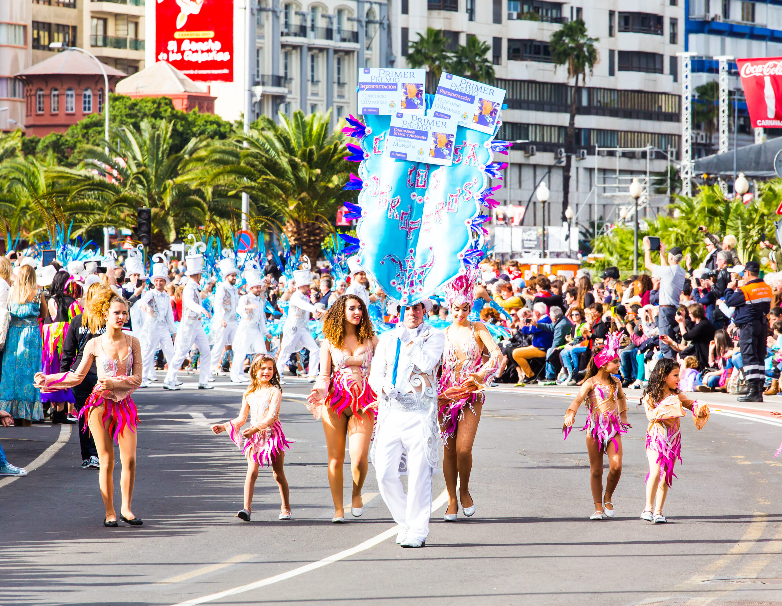 Dense but controlled Carnival crowd moving through Port of Spain with shared rhythm and forward motion