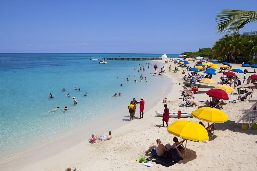 Tourists at Doctors Cave Beach
