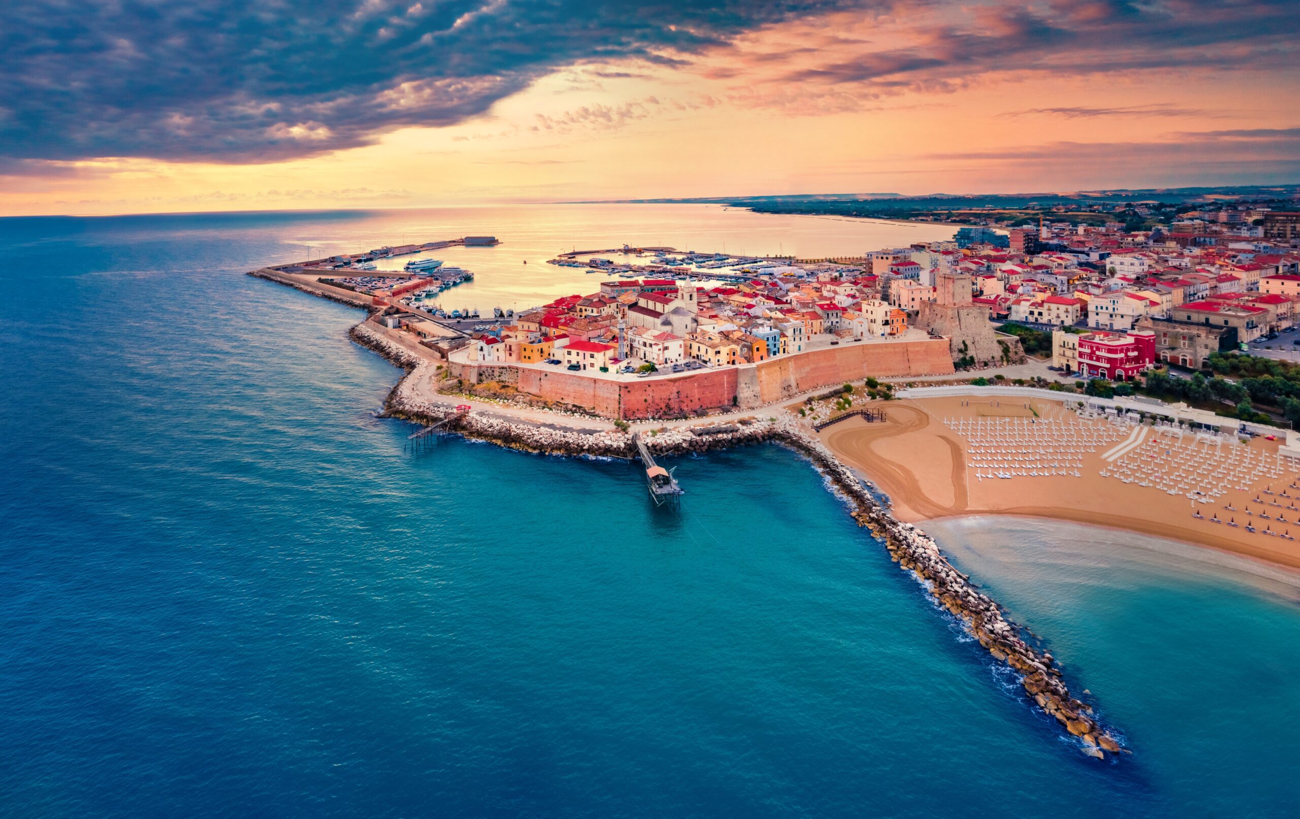 Port Antonio harbor at sunset with boats and mountains in Jamaica