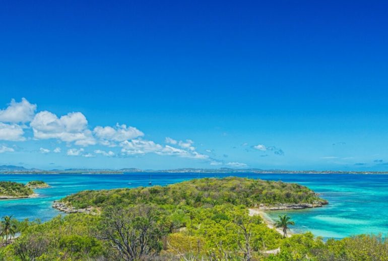 Editorial hero image capturing modern Caribbean life—culture, confidence, and understated sophistication