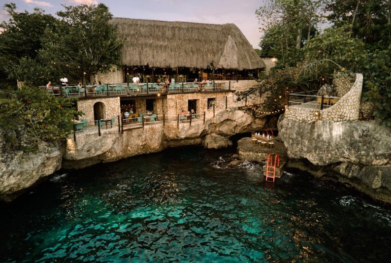 Rockhouse Restaurant Negril cliffside dining terrace overlooking the Caribbean Sea at sunset
