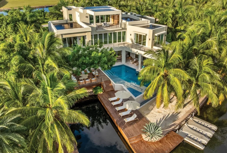 A Caribbean editorial lifestyle scene reflecting modern Caribbean culture, calm atmosphere, and a refined magazine aesthetic