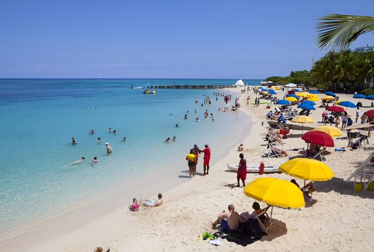 Tourists at Doctors Cave Beach